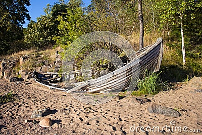Old broken boat on the shore. Stock Photo