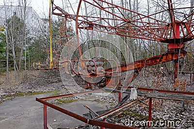 An old broken carousel in the abandoned city of Pripyat. Abandoned amusement park Editorial Stock Photo