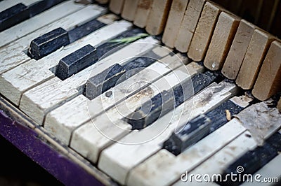 Old broken child piano Stock Photo