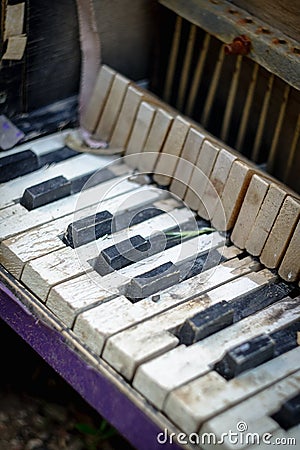 Old broken child piano Stock Photo