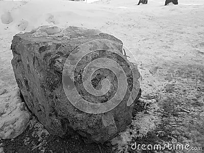 Old broken concrete block in the snow Stock Photo