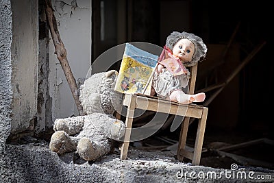 Old broken doll, children`s book, dusty bear, wooden chair on the window of an abandoned kindergarten in ghost town Pripyat, Editorial Stock Photo