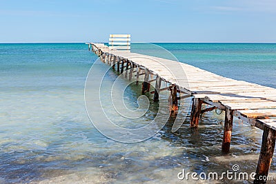 Old broken footbridge to the sea Stock Photo