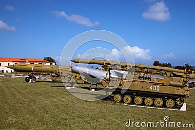 The old and broken, scratched Soviet Union rockets and armory, settled on Cuba, pointed out to the blue sky. Stock Photo