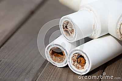 Sludge polypropylene plumbing pipes with rust and limescale. Corrosion and hard water concept. Rust broken water pipes Stock Photo