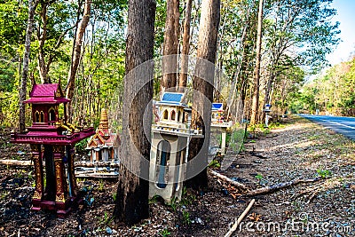 Old broken spirit houses or joss houses abandoned on the roadside. Stock Photo