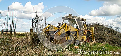 Old broken vintage yellow farm jcb digger Stock Photo