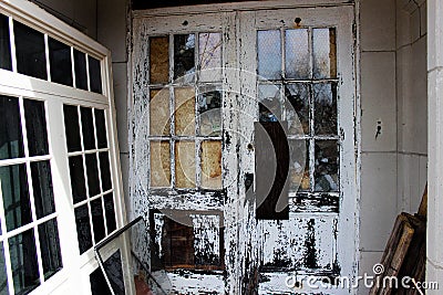 Old broken windows on abandoned brick asylum building Stock Photo