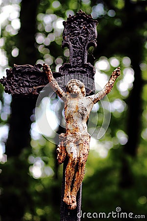 Old brokenness cross with crucifix Stock Photo