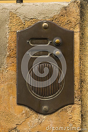 Old Bronze Door Intercom Buzzer Stock Photo