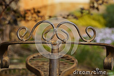 Old brown decorative iron bicycle steering wheel with forged pattern Stock Photo