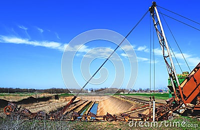 Old bucket excavator of transverse dripping conducts Stock Photo