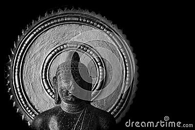 Old Buddha Statue carved in stone - Thanjavur Museum Editorial Stock Photo