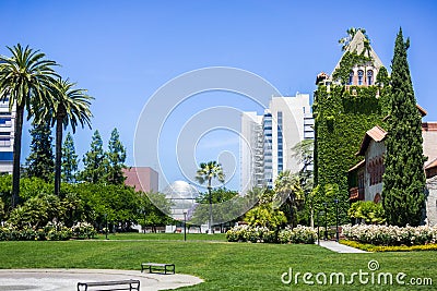 Old building at the San Jose State University; the modern City Hall building in the background; San Jose, California Stock Photo