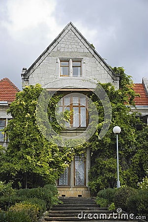 An old building with triangular roof. Stock Photo