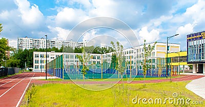 The old buildings of the new school, a playground for outdoor games in the middle. Editorial Stock Photo