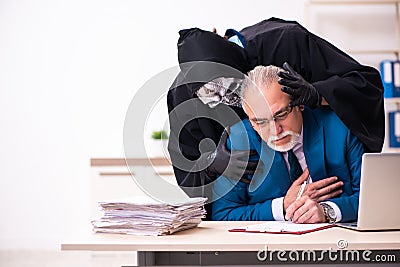 Old businessman employee getting deal with the devil Stock Photo