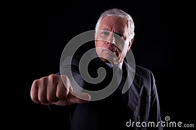 Old businessman with a hand with thumbs middle Stock Photo