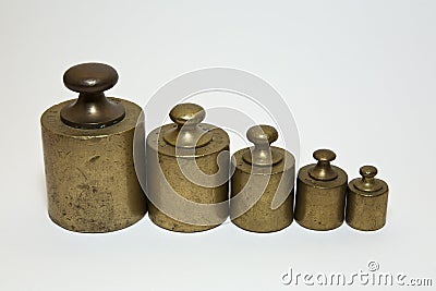 Old calibration weights in a row Stock Photo