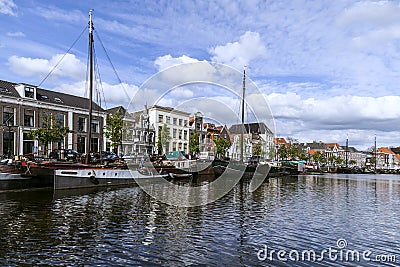 The old canals of Zwolle with beautiful old barges on the quay Editorial Stock Photo