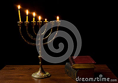 Old candelabrum and books Stock Photo