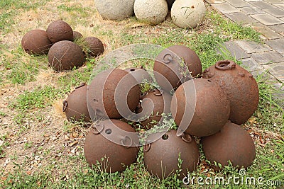 Old cannon balls at Castello Albertis Stock Photo