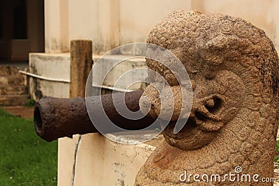 Old cannon with lion sculpture Stock Photo