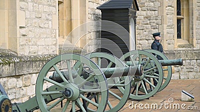 Old cannons at entrance to Museum. Action. Old small artillery cannons with wooden wheels stand at entrance to Editorial Stock Photo