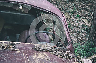 Old car abandoned in nature. Stock Photo