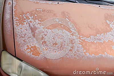 Old car engine hood rusty brown used paint faded grunge on front bonnet Stock Photo