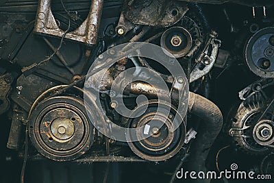 Old car engine spare part used closeup Serpentine belt vehicle machine dirty grease grunge with oil in garage Stock Photo