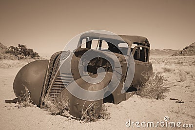 Old car in Namibian desert Stock Photo