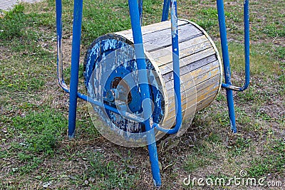 Old carousel on the playground. Self-isolation. An empty carousel with no children. Stock Photo