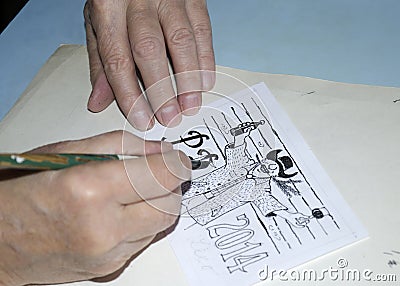 The old cartoonist hands drawing Stock Photo