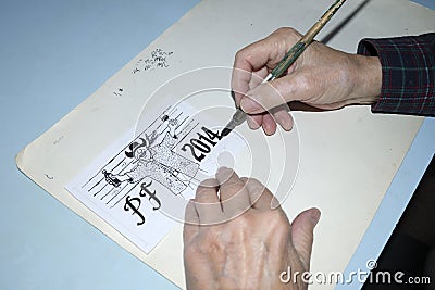 The old cartoonist hands drawing Stock Photo