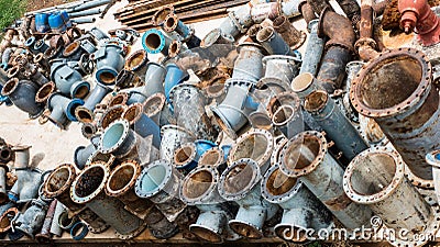 Old Cast iron pipe fittings in water treatment plant Stock Photo