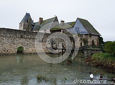 Old castle along water Stock Photo