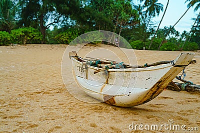 The old catamaran boat on the beach , Hikkaduwa, Sri Lanka. Stock Photo