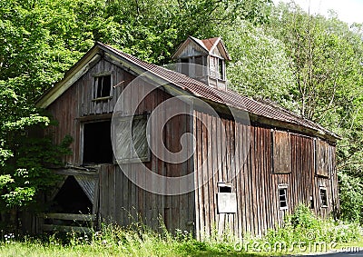 Old Cedar wood board-and-batten barn in country Stock Photo
