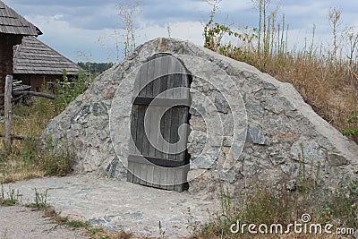 Old cellar with a wooden door Stock Photo