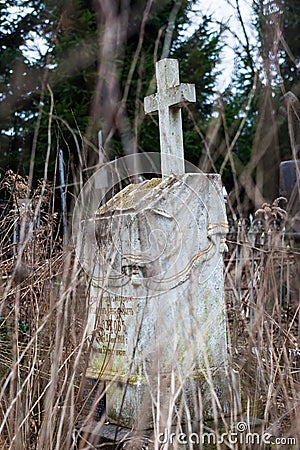 Old cemetery marble gravestone with the cross Stock Photo