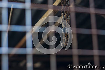 An old chain holding in a factory abandoned Stock Photo