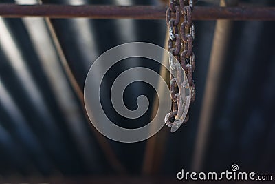 An old chain holding in a factory abandoned Stock Photo