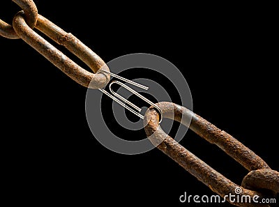 Old chain and new paperclip Stock Photo