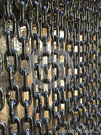 Old chain wall in garden Stock Photo