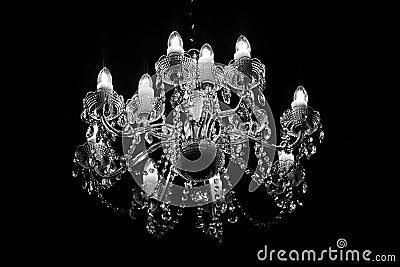 Old chandelier shining in the dark Stock Photo