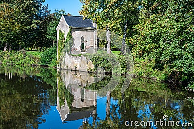 Old chapel reflecting in the water of the river Dender, Geraardsbergen, Flemish Region, Belgium Stock Photo