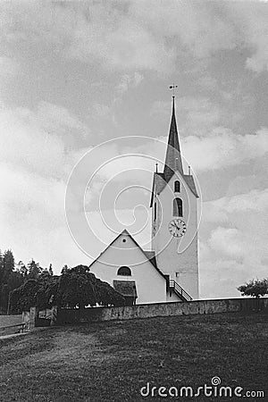 An old chapel in the village of Versam in the Swiss Alps with analogue photography - 2 Stock Photo