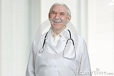 Old cheerful doctor is laughing. Stock Photo