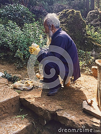 Old Chinese man with onions Editorial Stock Photo